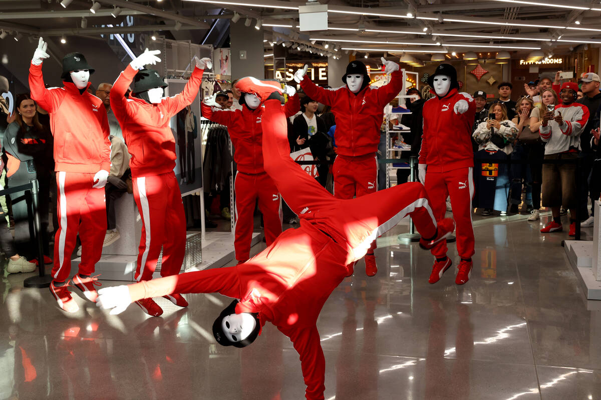 Jabbawockeez perform during the grand opening of PUMA on the Strip in Las Vegas Thursday, Nov. ...