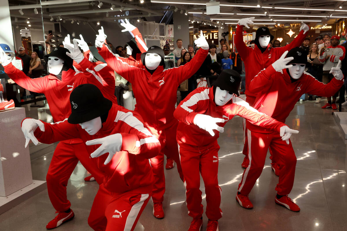 Jabbawockeez perform during the grand opening of PUMA on the Strip in Las Vegas Thursday, Nov. ...