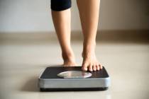 Controlling your weight lowers your triglycerides and improves your HDL levels. (Getty Images)