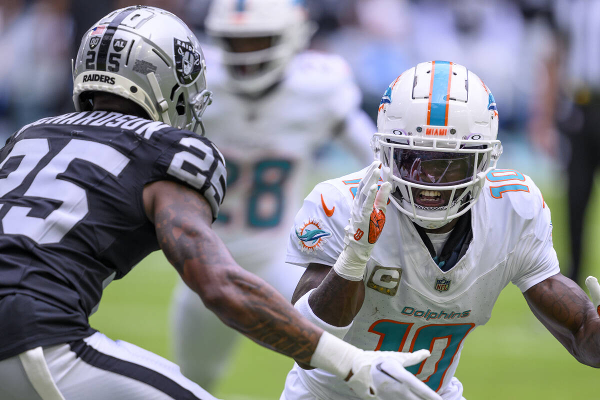 Miami Dolphins wide receiver Tyreek Hill (10) runs a play as Las Vegas Raiders cornerback Decam ...