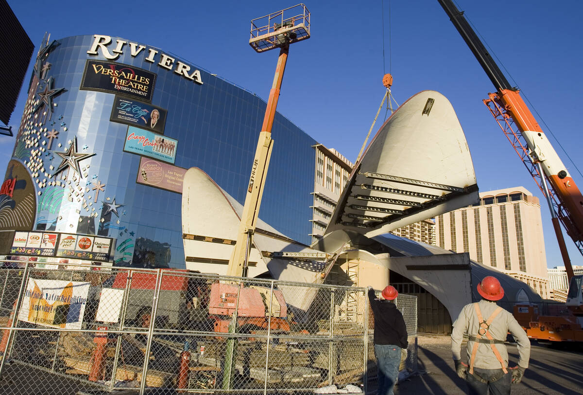 FILE - Part of the historic La Concha Motel lobby is hoisted by crane on the Las Vegas Strip as ...