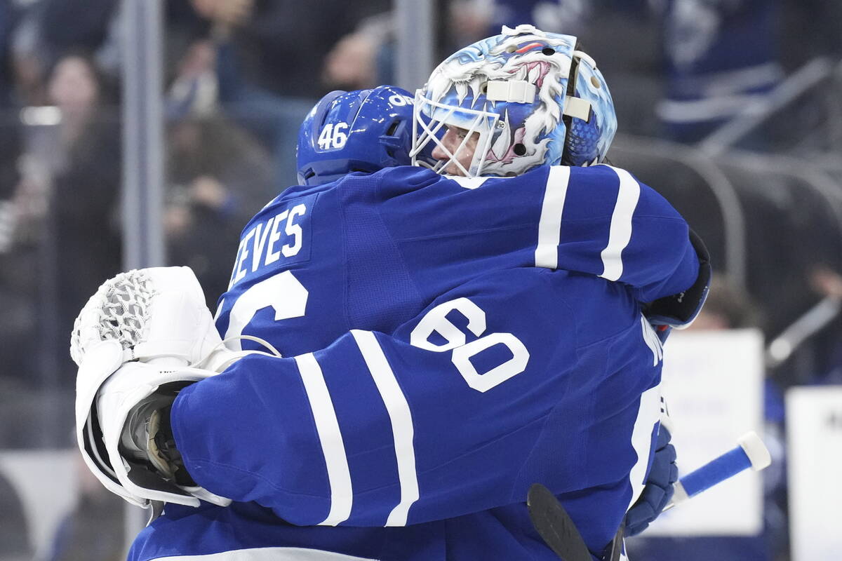 Toronto Maple Leafs' goaltender Joseph Woll (60) is congratulated by Alex Steeves after their t ...