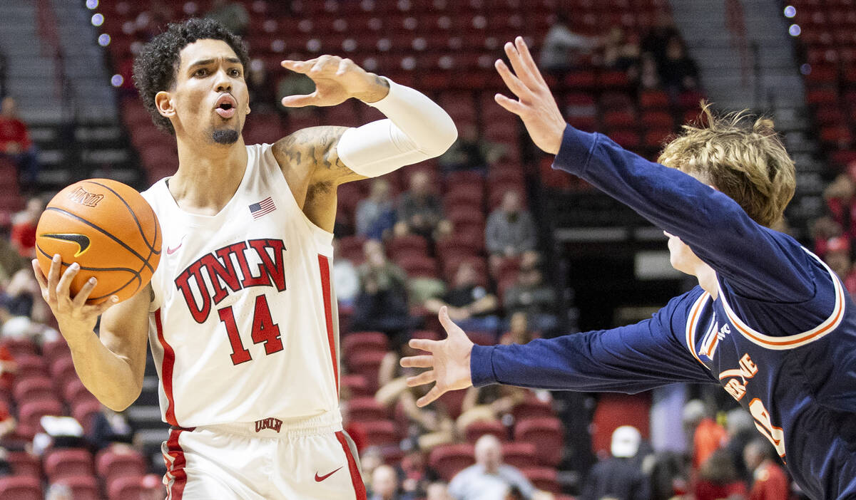 UNLV guard Jailen Bedford (14) directs his teammates during the college basketball game against ...