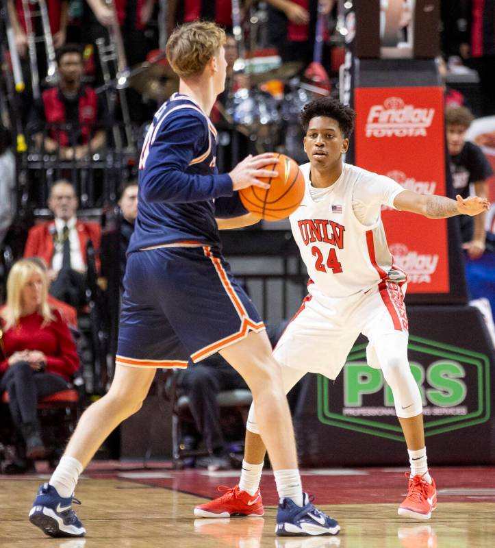 UNLV guard DeMarion Yap (24) guards Pepperdine Waves guard Jaxon Olvera, left, during the colle ...