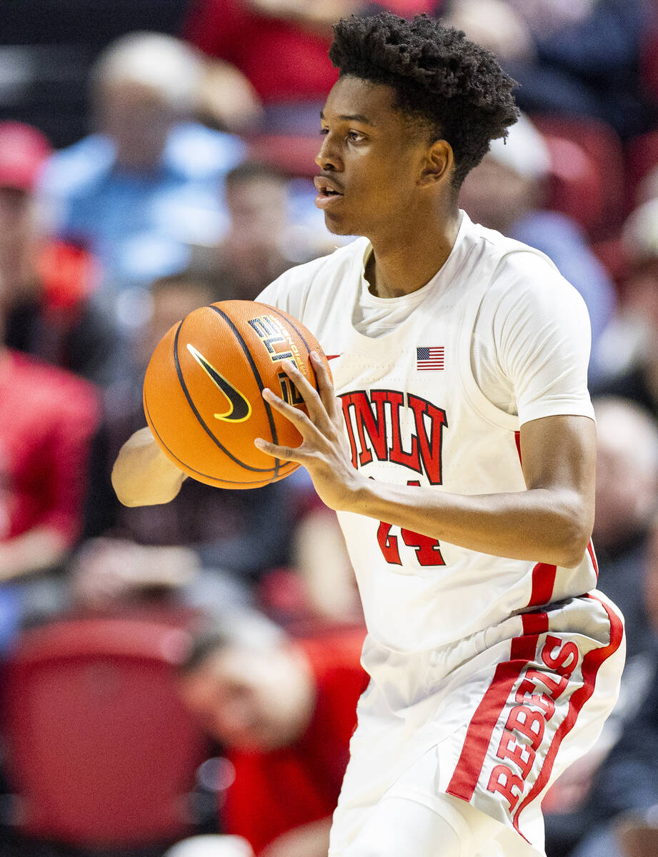 UNLV guard DeMarion Yap (24) looks to pass the ball during the college basketball game against ...