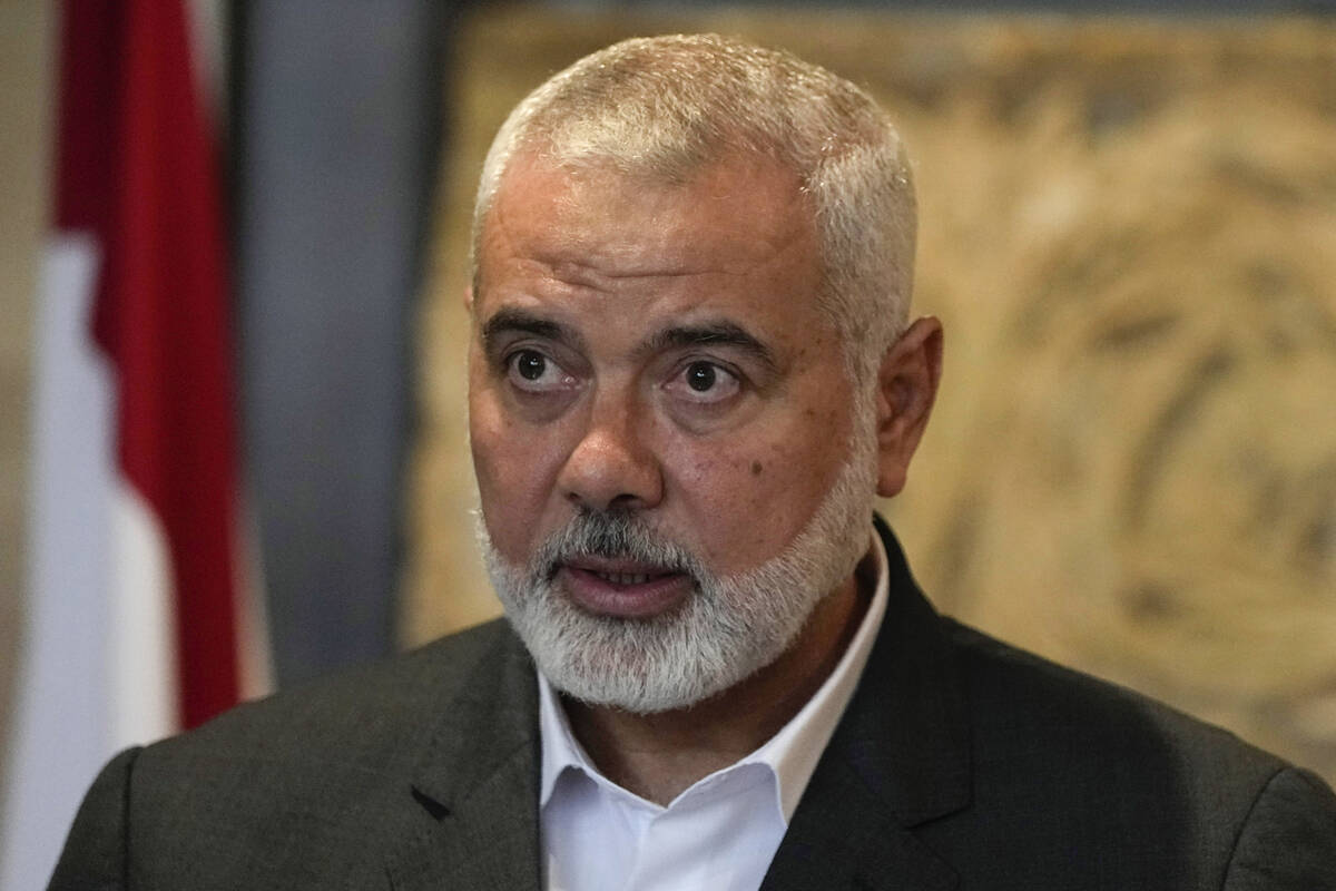 Ismail Haniyeh, leader of the Palestinian militant group Hamas, speaks to journalists after his ...