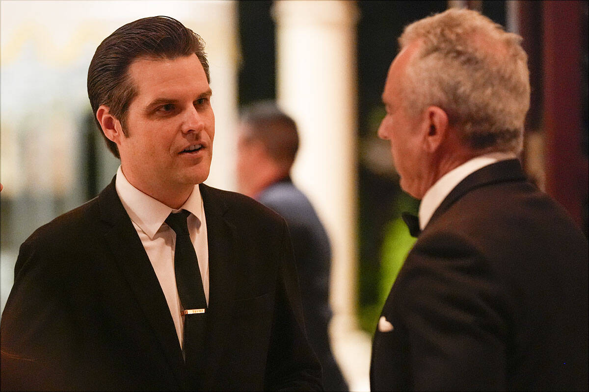 Matt Gaetz talks with Robert F. Kennedy Jr., before President-elect Donald Trump speaks during ...