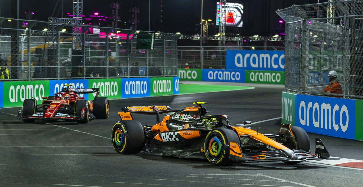 McLaren driver Lando Norris leads Ferrari driver Carlos Sainz around a corner at the Sphere dur ...