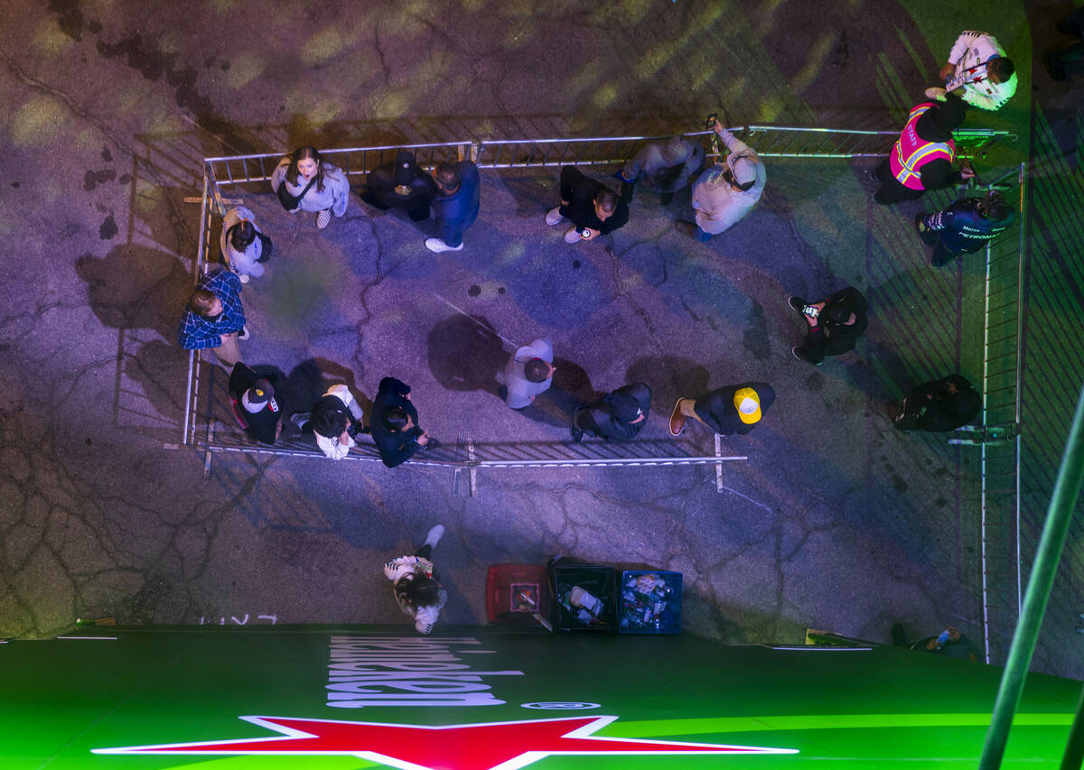 People stand in line to climb the Heineken tower to check out the view during the Formula One o ...