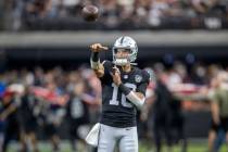 Raiders quarterback Desmond Ridder (10) throws the football before an NFL game against the Kans ...