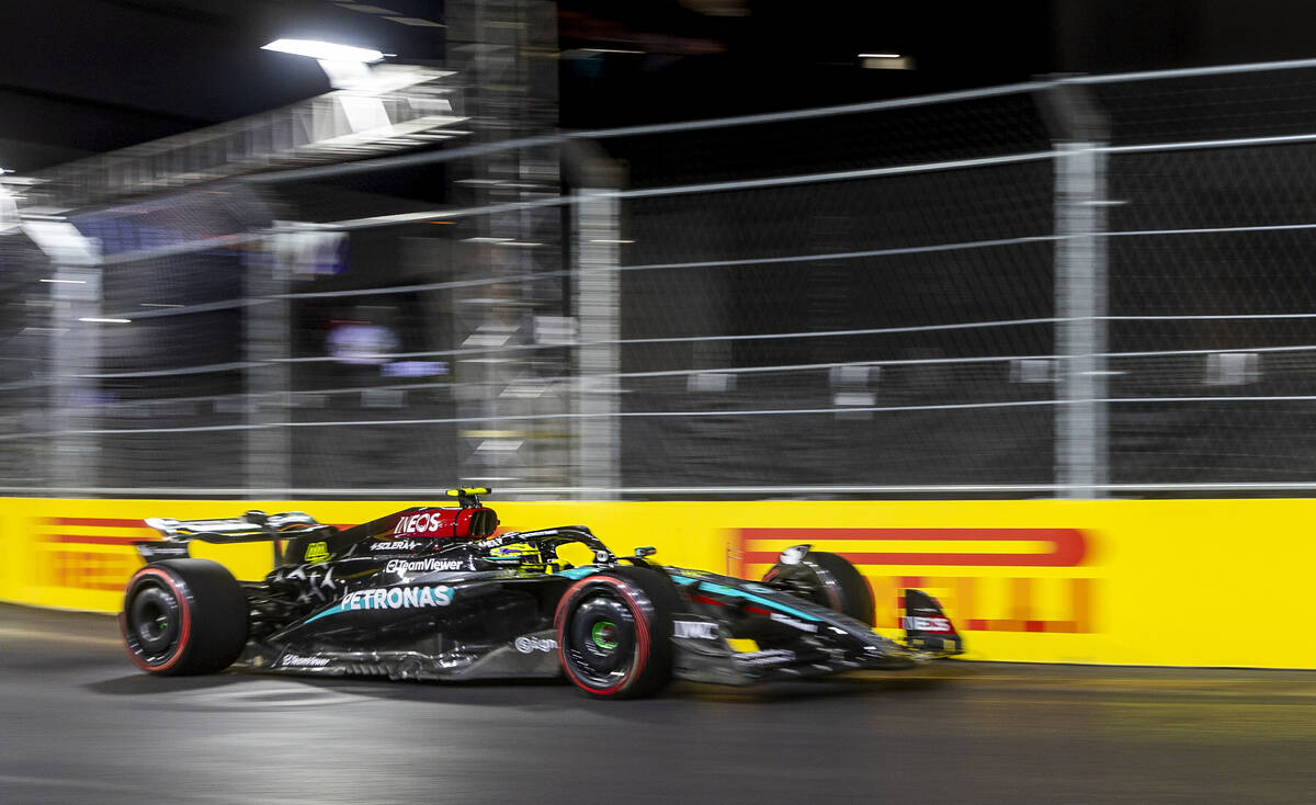 Mercedes driver Lewis Hamilton turns the corner onto E. Harmon Avenue during the third practice ...