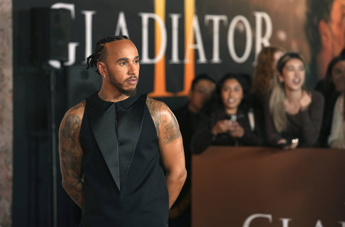 Race car driver Lewis Hamilton poses at the premiere of the film "Gladiator II" on Mo ...