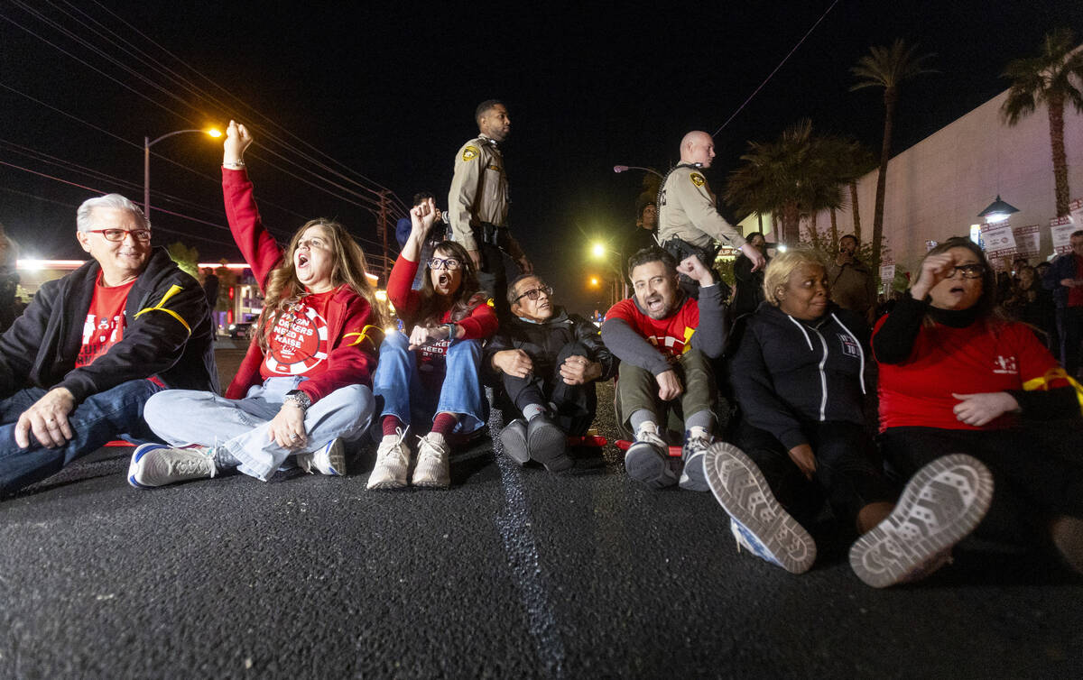 Culinary Workers Union members and Virgin Hotels workers sit in the street and protest on South ...