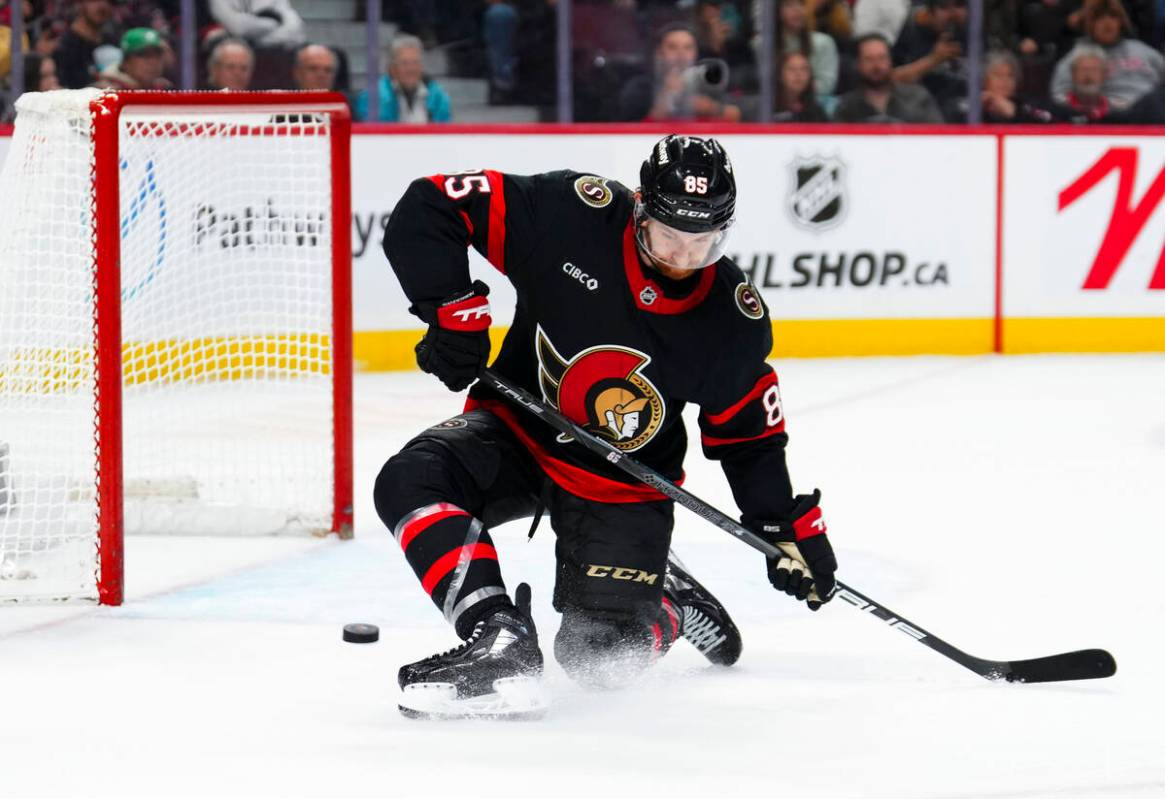 Ottawa Senators defenseman Jake Sanderson makes a save in front of his empty net during the fin ...