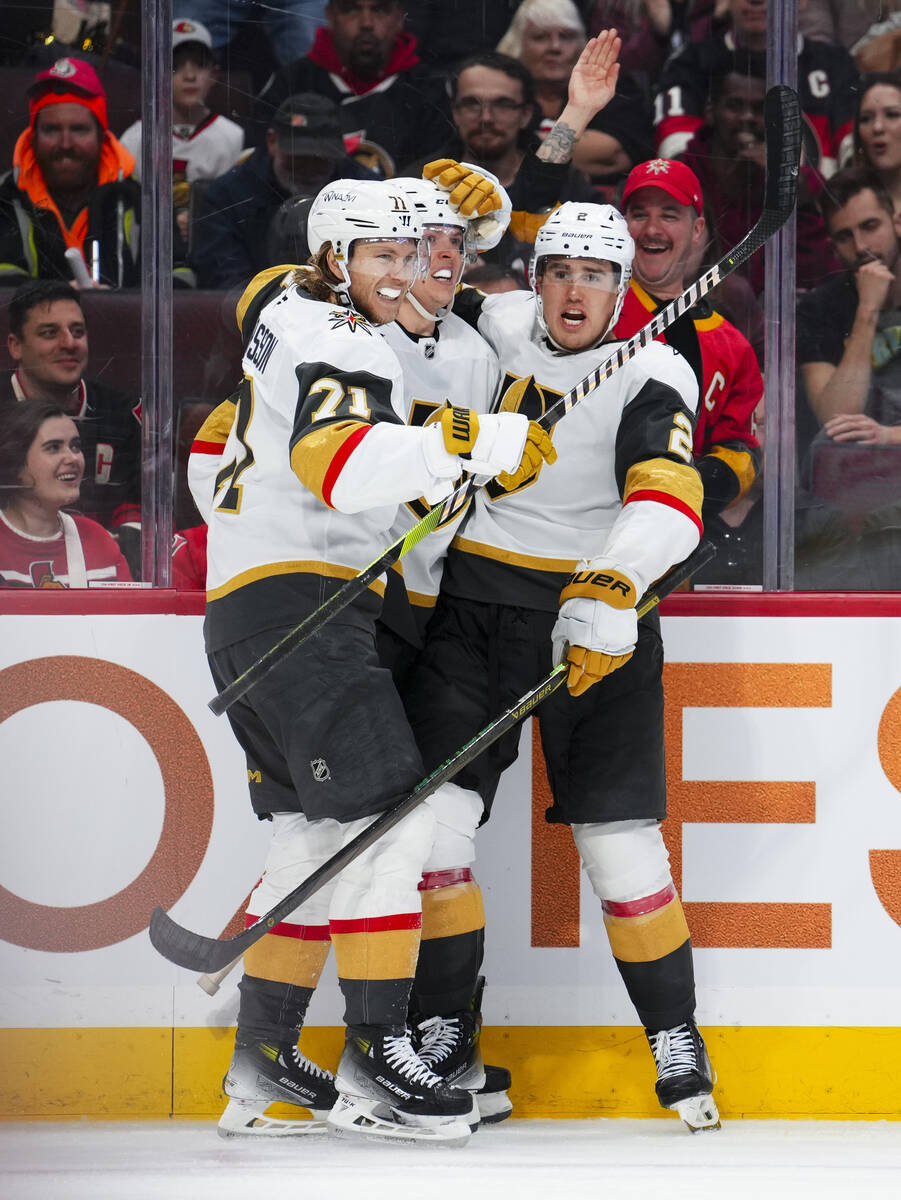 Vegas Golden Knights left wing Pavel Dorofeyev, center, celebrates after his goal with teammate ...