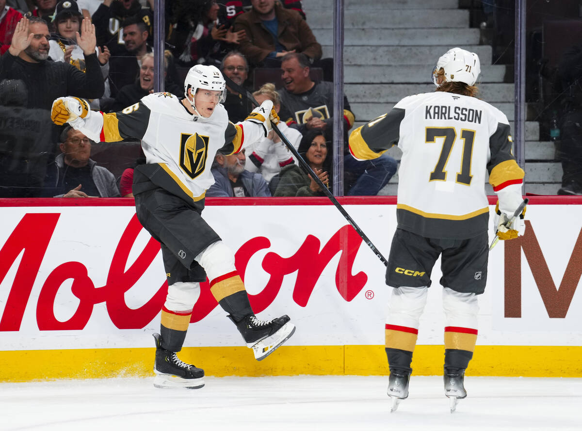 Vegas Golden Knights left wing Pavel Dorofeyev (16) celebrates after his goal with center Willi ...