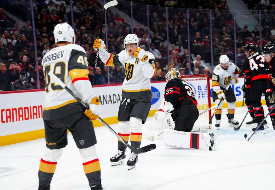 Vegas Golden Knights center Jack Eichel (9) celebrates with teammate Ivan Barbashev (49) after ...