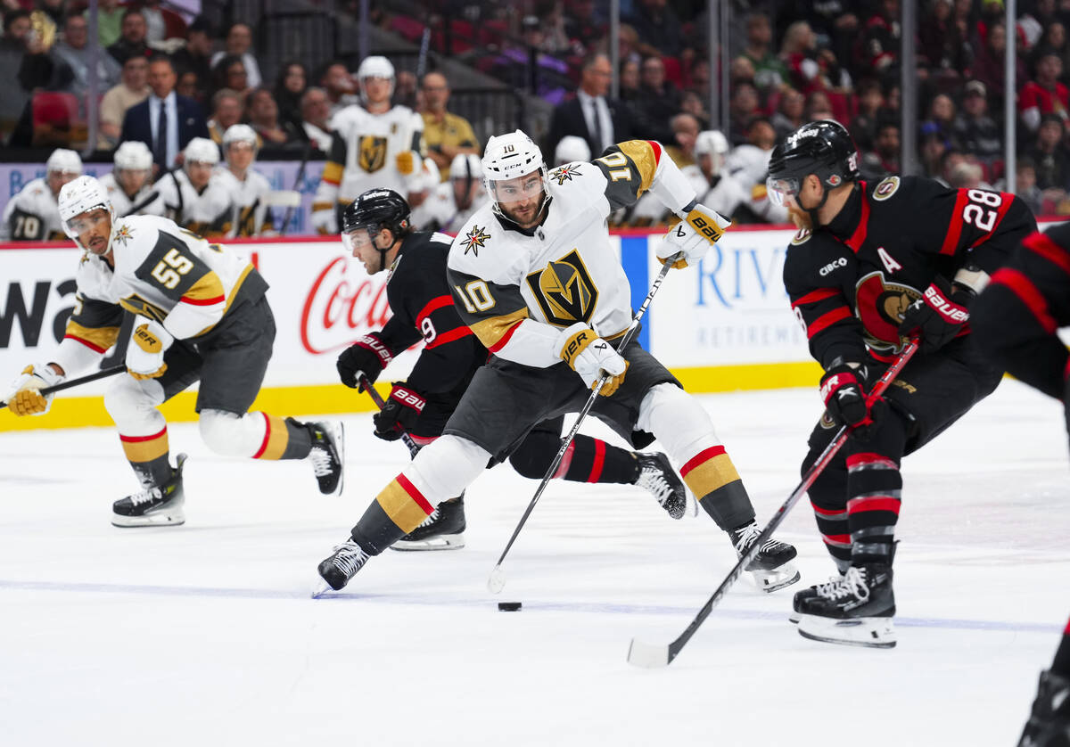 Vegas Golden Knights centre Nicolas Roy (10) skates with the puck as he makes a move around Ott ...