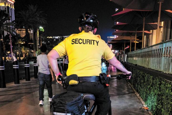 A security guard bikes near the Paris Hotel and Casino on the Las Vegas Strip, early Thursday, ...