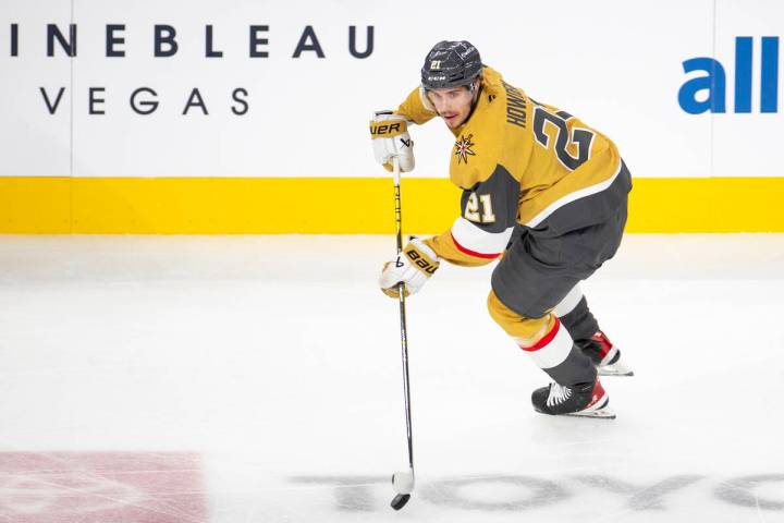 Vegas Golden Knights center Brett Howden (21) skates with the puck during the NHL hockey game a ...