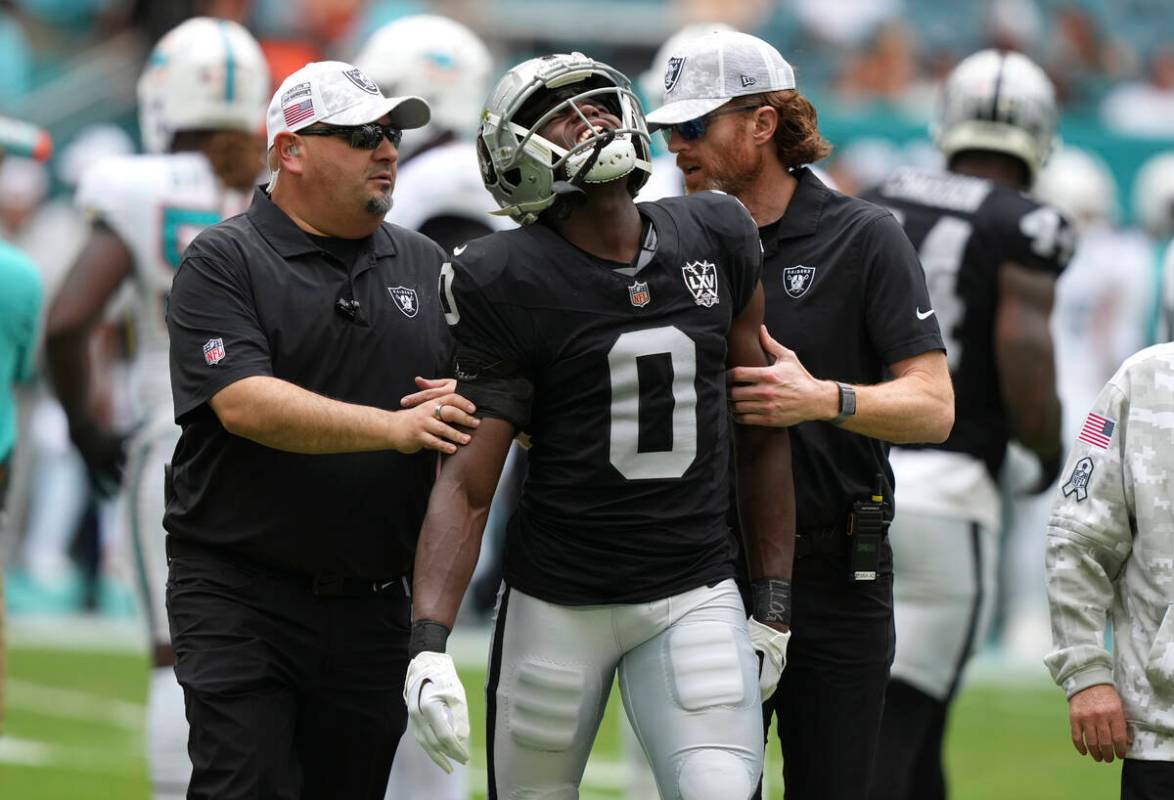 Las Vegas Raiders cornerback Jakorian Bennett (0) is led off the field during the first half of ...