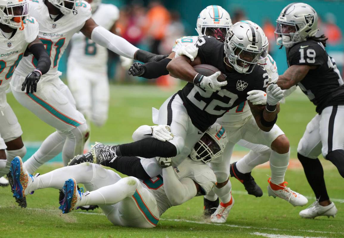 Las Vegas Raiders running back Alexander Mattison (22) runs for a first down during the second ...