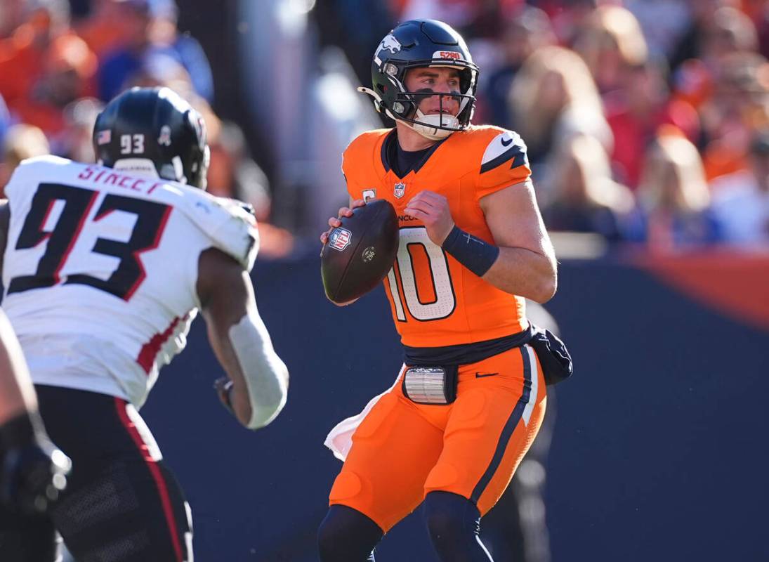 Atlanta Falcons defensive tackle Kentavius Street (93) pursues Denver Broncos quarterback Bo Ni ...