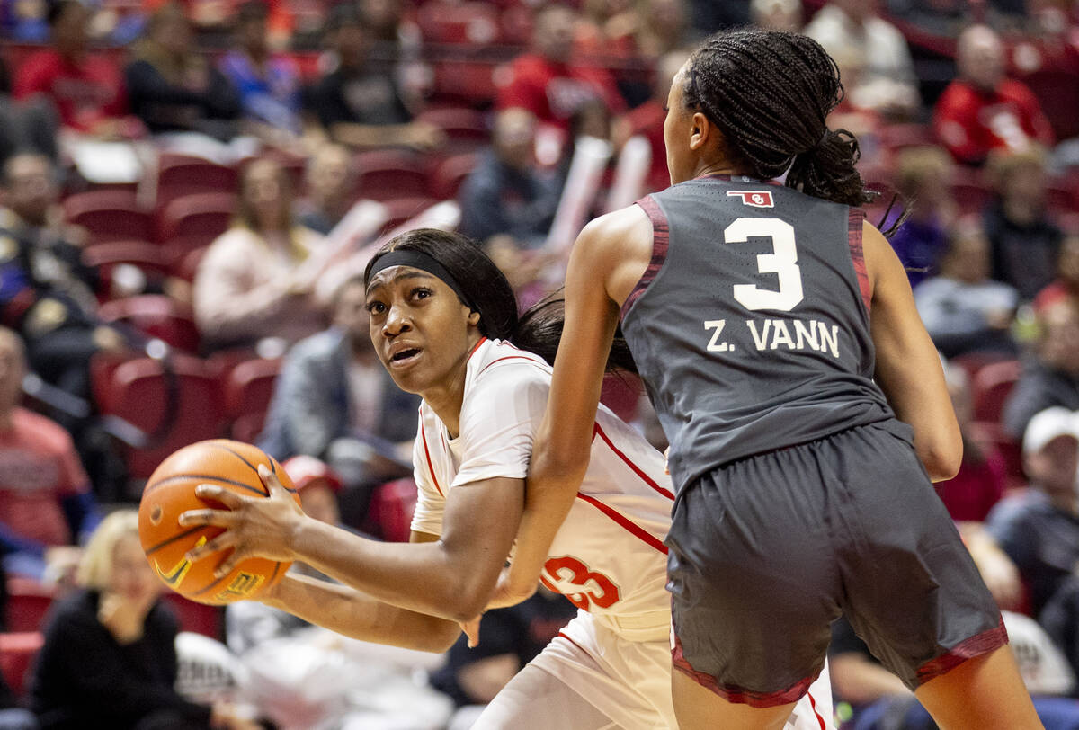 UNLV guard Amarachi Kimpson, left, attempts to move around Oklahoma Sooners guard Zya Vann (3) ...