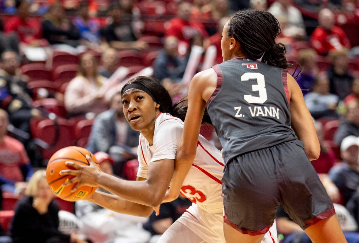 UNLV guard Amarachi Kimpson, left, attempts to move around Oklahoma Sooners guard Zya Vann (3) ...