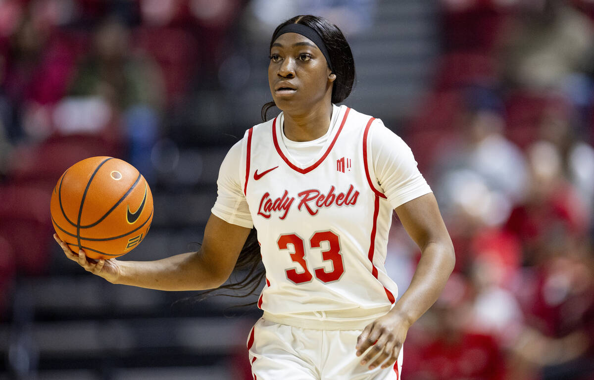 UNLV guard Amarachi Kimpson (33) controls the ball during the college basketball game against t ...