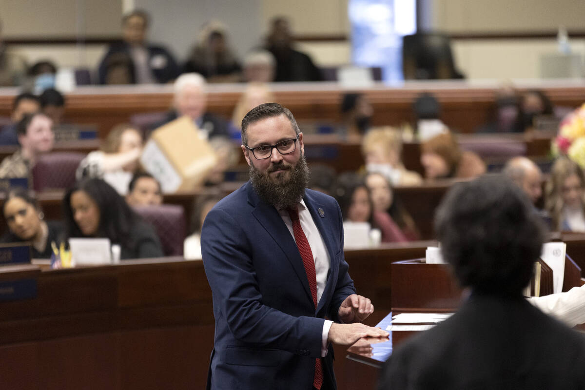 Assemblyman Gregory Hafen II, R-Pahrump, looks to Chief Justice Lidia S. Stiglich after signing ...