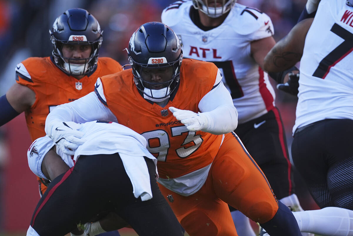 Denver Broncos defensive tackle D.J. Jones (93) makes a stop in the first half of an NFL footba ...