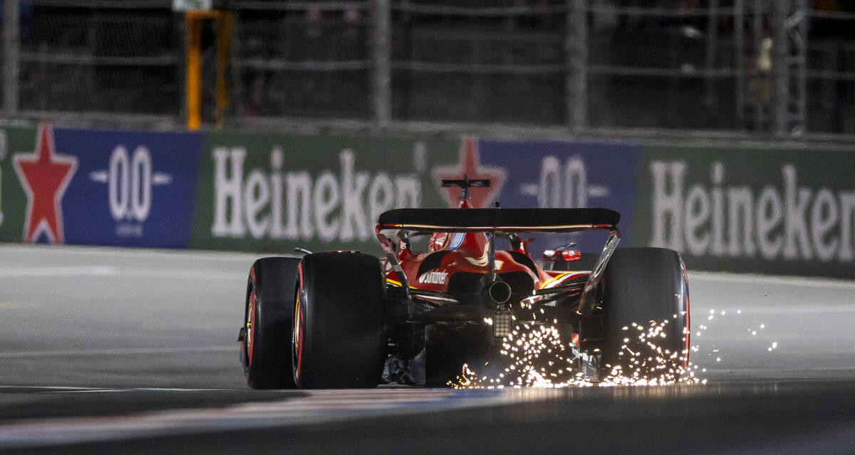 Sparks kick up from Ferrari driver Charles Leclerc on the last turn during the third practice r ...