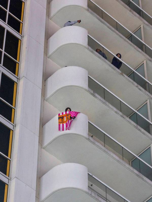 Fans watch from apartments above E. Harmon Avenue during the third practice round for the Formu ...