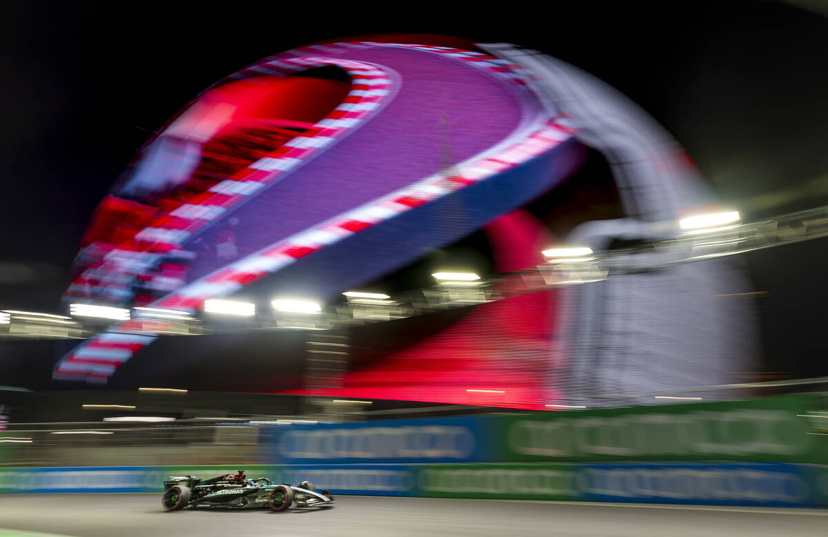 Mercedes driver George Russell navigates around the MSG Sphere on his way to the pole position ...