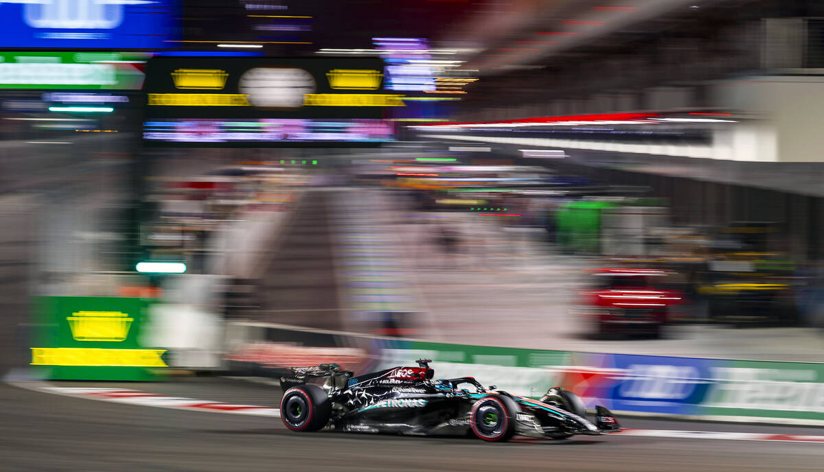 Mercedes driver George Russell navigates around turn one on his way to the pole position during ...