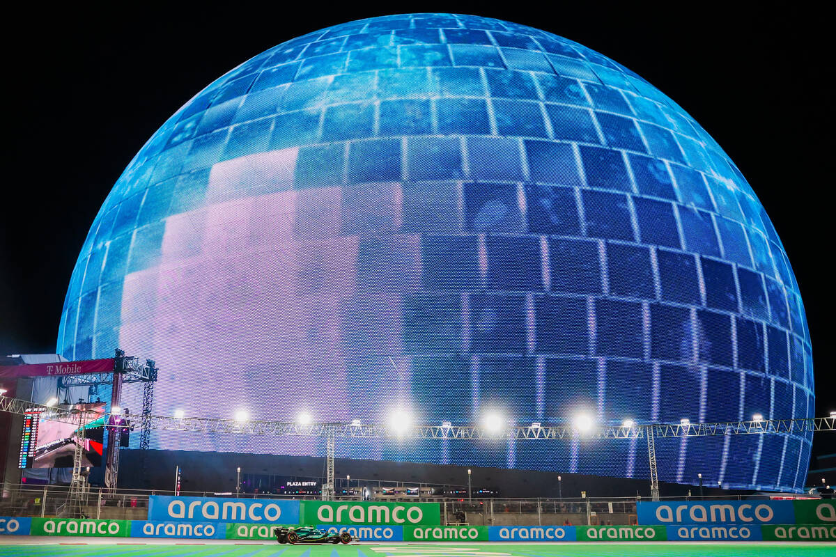 A race car speeds past the Sphere during a free practice ahead of the Formula 1 Las Vegas Grand ...