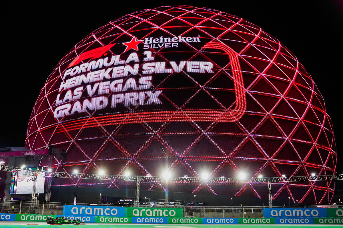 A race car speeds past the Sphere during a free practice ahead of the Formula 1 Las Vegas Grand ...