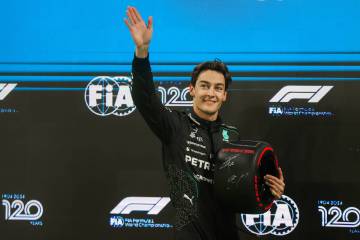 Formula 1 Mercedes driver George Russell waves to fans after coming in first during a qualifyin ...