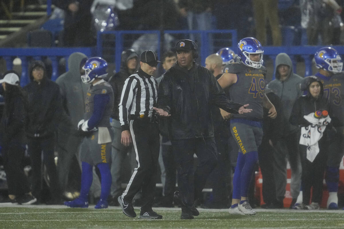 San Jose State head coach Ken Niumatalolo, center right, reacts during the second half of an NC ...