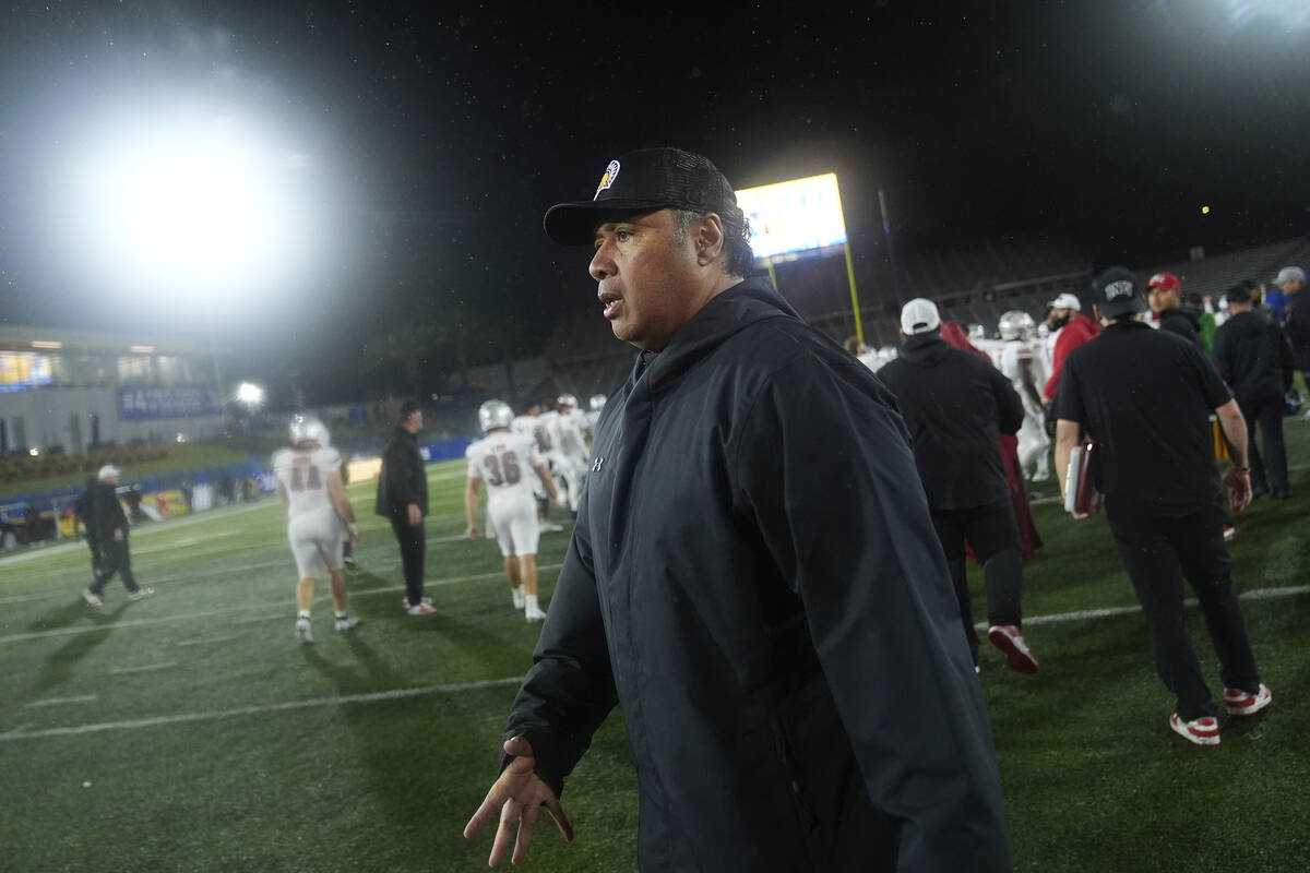 San Jose State head coach Ken Niumatalolo, center, walks off the field after the team's loss to ...