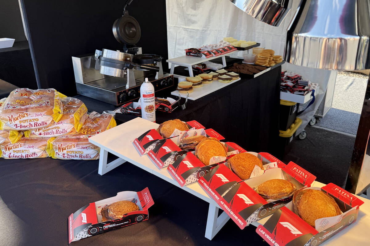 Pressed burgers in cardboard F1 racecar boxes are shown at T-Mobile Zone at Sphere during F1 La ...