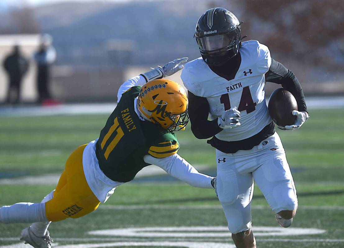 Faith Lutheran’s Cale Breslin looks to run against Bishop Manogue during the Class 5A Divisio ...