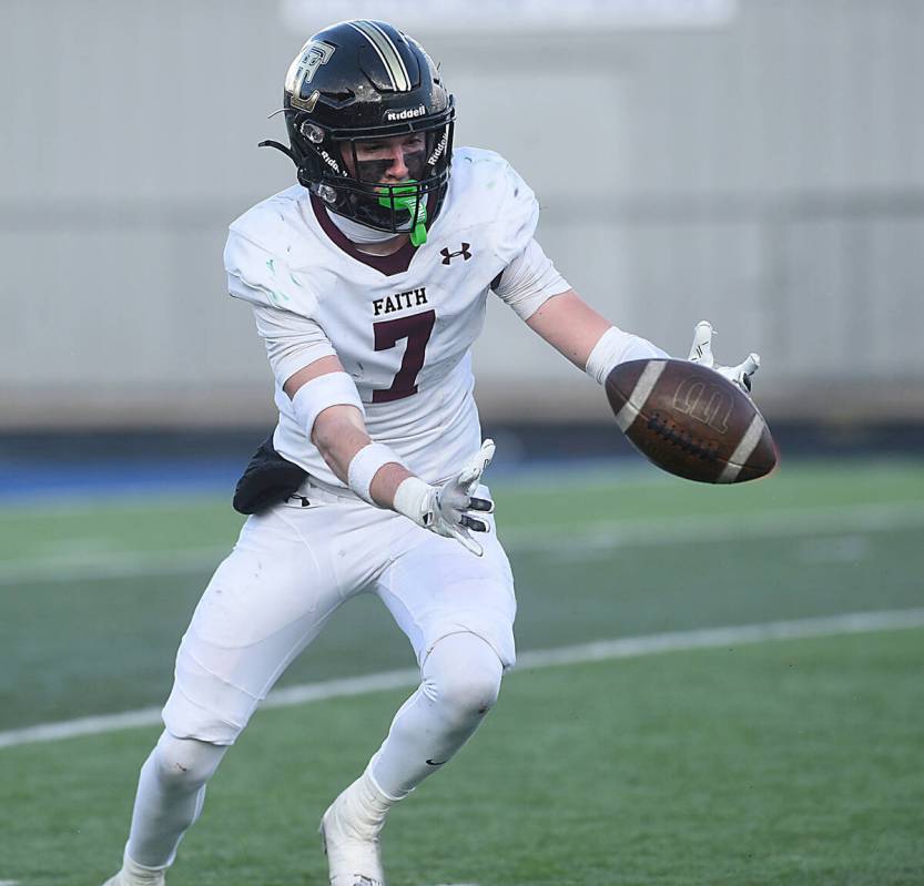 Faith Lutheran’s Matthew Mason recovers a blocked punt for a score against Bishop Manogue dur ...