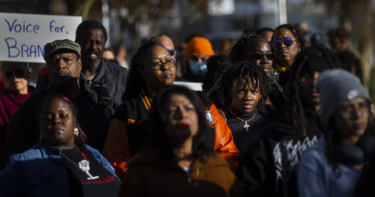 People participate in a rally for Brandon Durham, who was shot and killed by police in his own ...