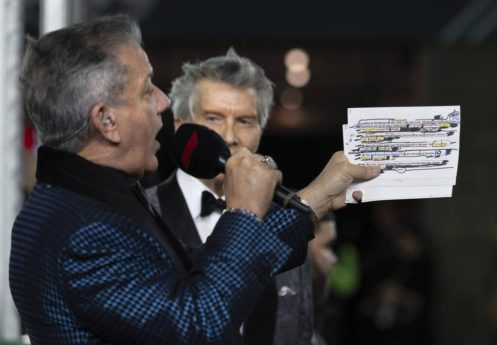 Bruce Buffer and his brother Michael take turns introducing the drivers on the track during the ...