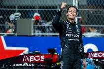 Mercedes driver George Russell celebrates his race win at the finish line of the Formula 1 Las ...