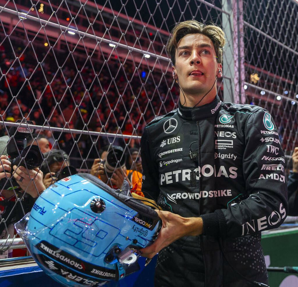 Mercedes driver George Russell readies to race as teams assemble on the track during the Formul ...