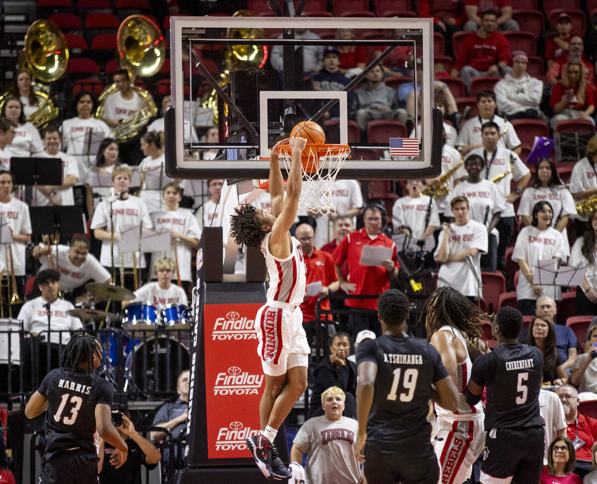 UNLV guard Dedan Thomas Jr. (11) dunks the ball during the college basketball game against the ...