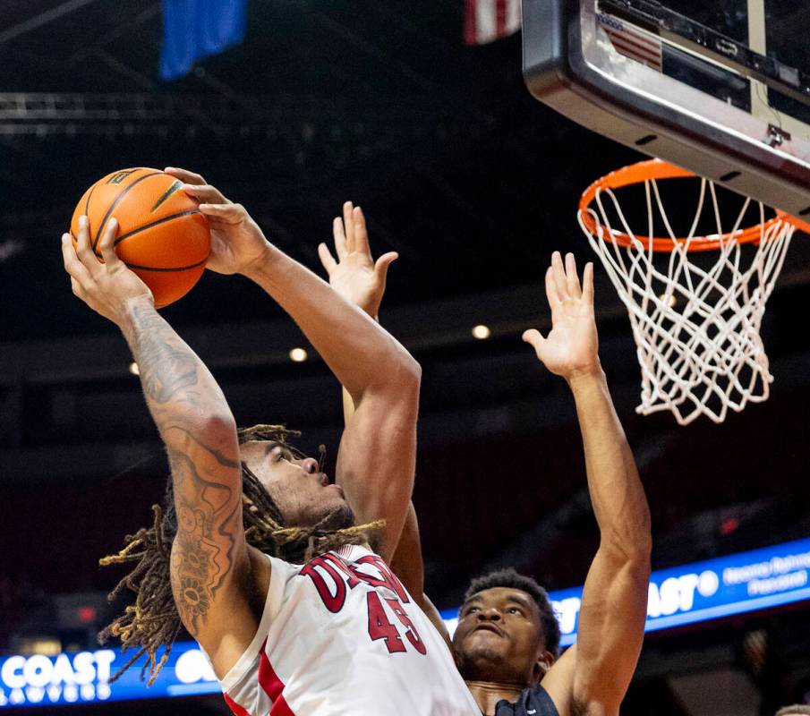 UNLV forward Jeremiah Cherry (45) attempts a shot during the college basketball game against th ...